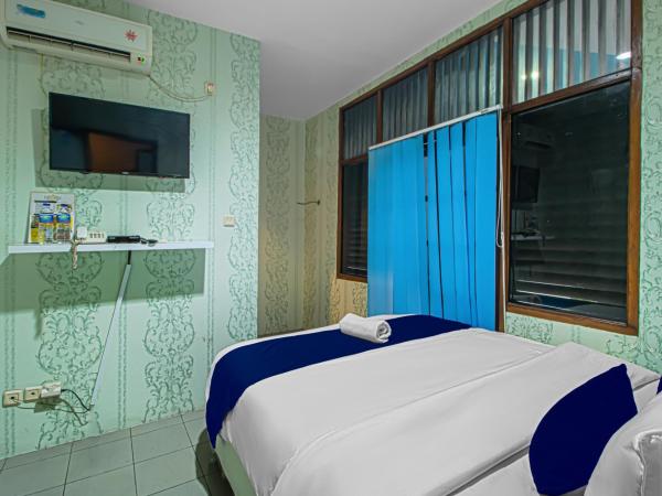 Bungur Inn Syariah : photo 6 de la chambre chambre lit queen-size