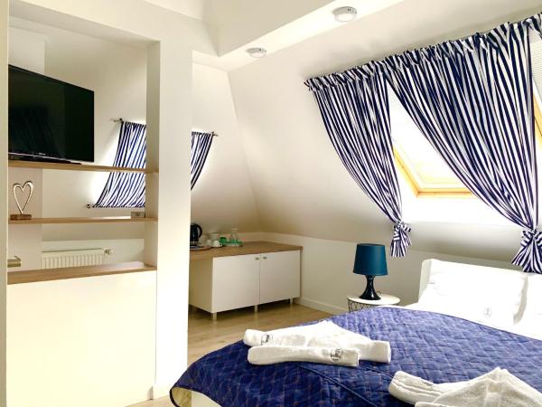 Willa 4 Pory Roku & Uznam : photo 2 de la chambre small double room in the attic with terrace