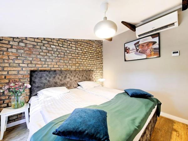 Cinema Apartments : photo 8 de la chambre suite deluxe avec lit king-size