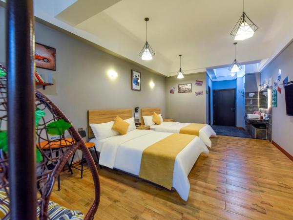 Chongqing Ouranjian Lake View Guesthouse : photo 7 de la chambre chambre lits jumeaux