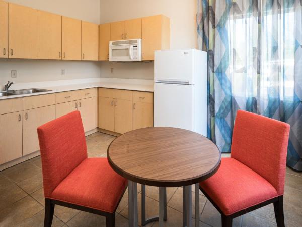 Holiday Inn Express & Suites Orlando International Airport, an IHG Hotel : photo 2 de la chambre suite lit king-size - accessible aux personnes à mobilité réduite