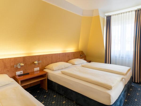 Aparthotel Astro - Nichtraucherhotel : photo 1 de la chambre chambre triple