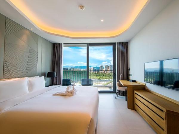Oakwood Apartments Sanya : photo 3 de la chambre appartement 1 chambre - vue sur jardin