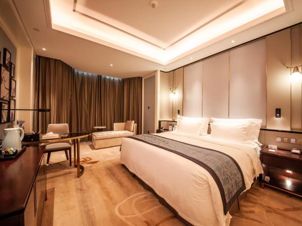 Wyndham Qingdao : photo 2 de la chambre elegant family suite with 2 king bed rooms