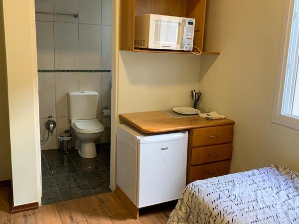 Vila Stellino Suítes : photo 4 de la chambre grande chambre simple