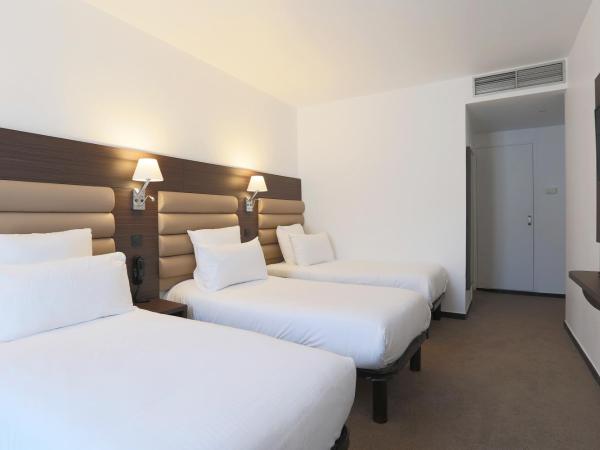 Hôtel & Appartements Monsigny : photo 7 de la chambre chambre quadruple