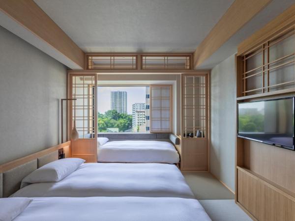 ONSEN RYOKAN Yuen Sapporo : photo 1 de la chambre chambre lits jumeaux hollywood avec douche et lit d'appoint - non-fumeurs