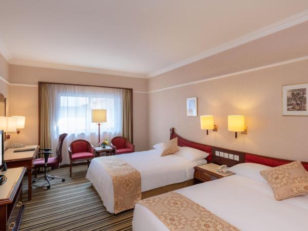 Metropark Lido Hotel Beijing : photo 1 de la chambre chambre lit king-size standard avec accès au salon