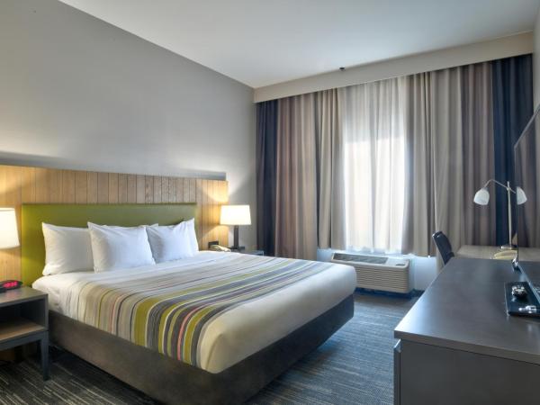 Country Inn & Suites by Radisson, Oklahoma City Airport, OK : photo 3 de la chambre suite 1 chambre lit king-size avec canapé-lit