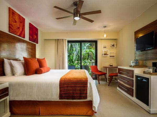 Sunscape Sabor Cozumel : photo 4 de la chambre hébergement lit king-size deluxe - vue tropicale