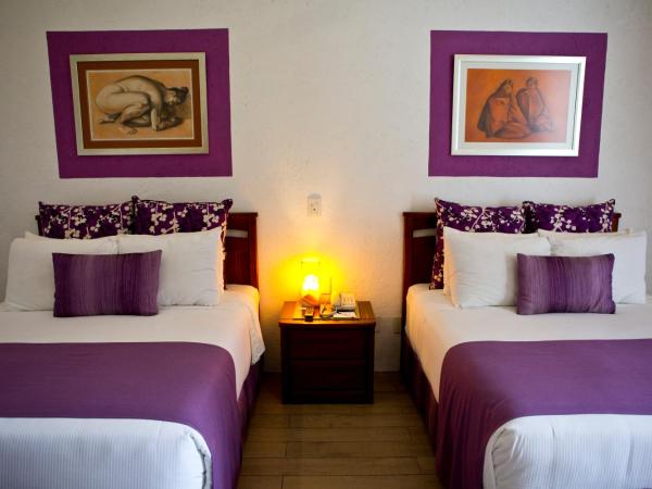 Radisson Hotel Cuernavaca : photo 1 de la chambre chambre deluxe avec 2 lits queen-size - vue sur jardin - non-fumeurs