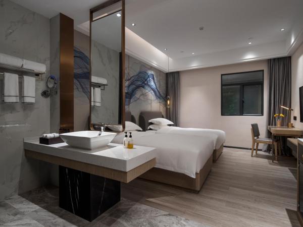 Paco Hotel Jinfeng Metro Guangzhou - Free Shuttle Bus For Canton Fair : photo 2 de la chambre chambre lits jumeaux supérieure