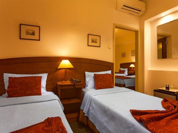 Vera Cruz Porto Downtown Hotel : photo 2 de la chambre chambre quadruple