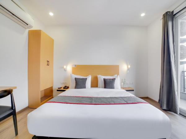 Flora Residency : photo 4 de la chambre chambre double ou lits jumeaux