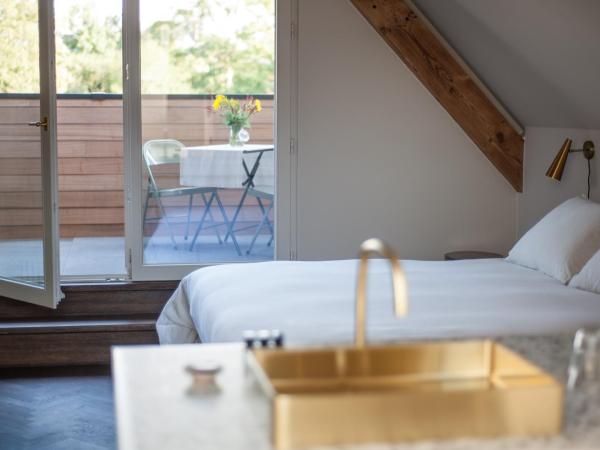 B'Guest Sleep & Retreat : photo 3 de la chambre suite lit king-size avec balcon