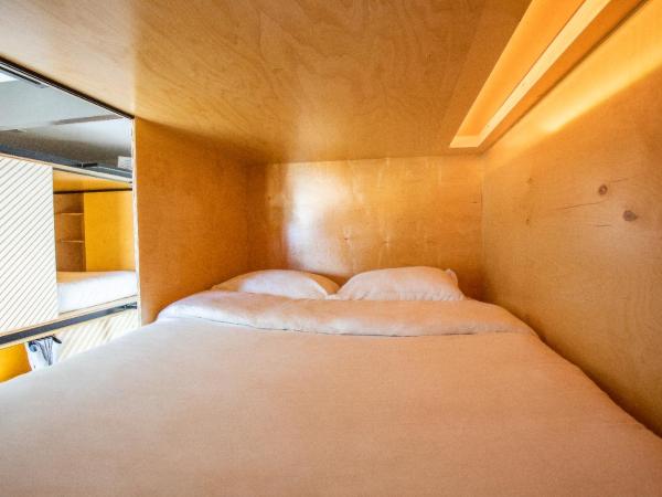 Haven Coliving : photo 3 de la chambre lit simple dans dortoir pour hommes avec salle de bains commune