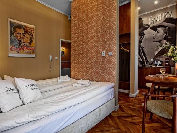 Stare Kino Cinema Residence : photo 1 de la chambre appartement avec lit double