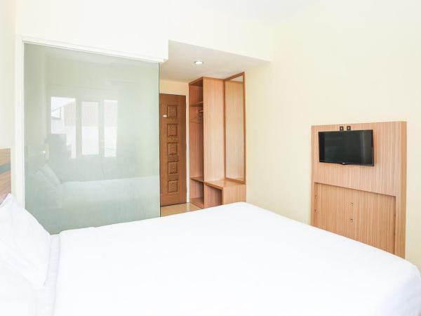 Pratisarawirya Guesthouse by ecommerceloka : photo 10 de la chambre chambre double standard