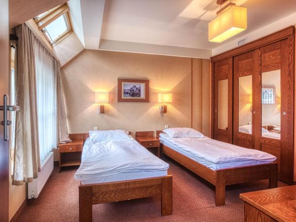 Dom Oliwski : photo 2 de la chambre chambre lits jumeaux