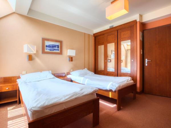 Dom Oliwski : photo 4 de la chambre chambre lits jumeaux