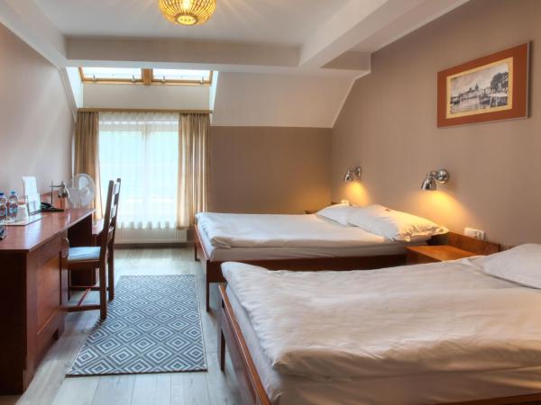 Dom Oliwski : photo 1 de la chambre chambre triple - vue sur jardin