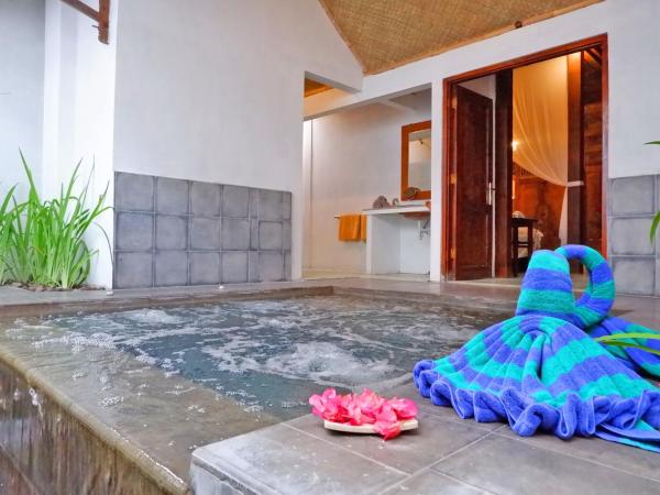 D'omah Yogya Hotel : photo 1 de la chambre staycation offer - heritage suite with private jacuzzi