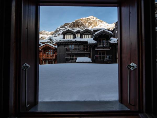 La Savoyarde : photo 3 de la chambre chambre double ou lits jumeaux avec baignoire - côté village