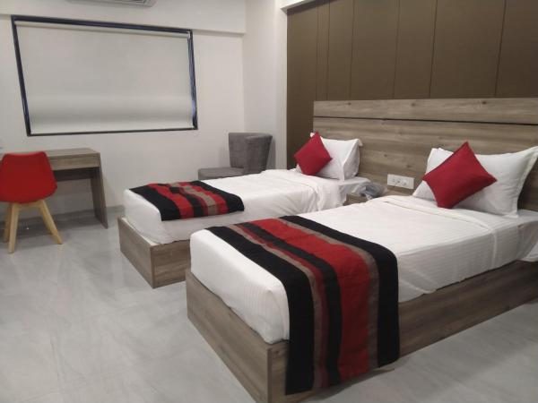 HOTEL INDUS INN : photo 1 de la chambre chambre deluxe double ou lits jumeaux