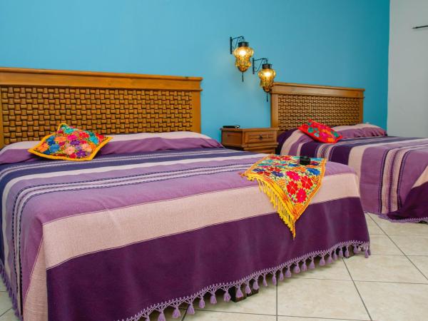 Departamentos Claussen : photo 5 de la chambre chambre lits jumeaux deluxe - vue sur mer