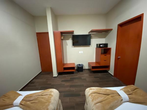 La Lola Hotel & Suites : photo 2 de la chambre chambre double