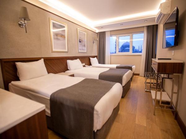 Sogut Hotel Old City : photo 1 de la chambre chambre triple