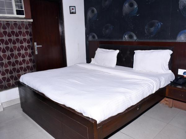 Hotel Flora Inn : photo 5 de la chambre chambre deluxe (1 adulte + 2 enfants)