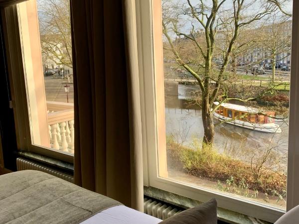 Spinoza Suites : photo 8 de la chambre suite lit king-size avec balcon