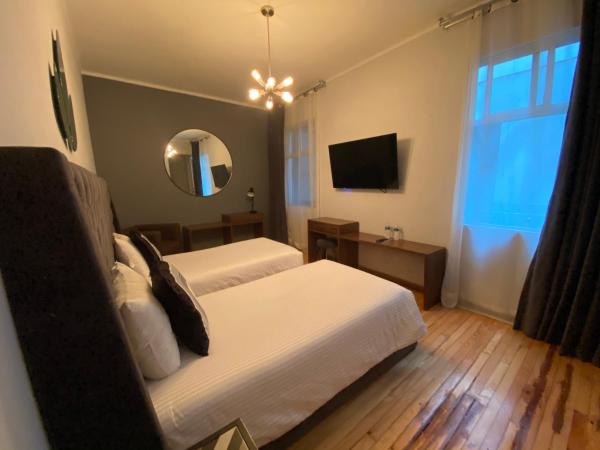 Suites Alcazar : photo 3 de la chambre chambre lits jumeaux standard