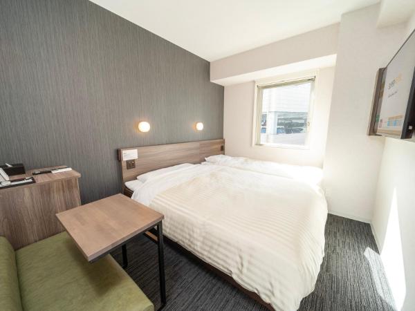 Super Hotel Hiroshima Yagenboridori : photo 1 de la chambre chambre lits jumeaux