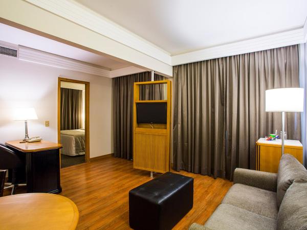 Estanplaza International : photo 1 de la chambre suite lit queen-size deluxe