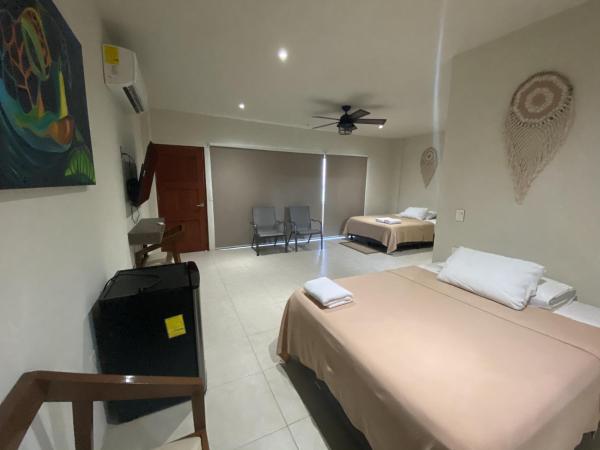 Cuxos Hotel Beachfront : photo 8 de la chambre chambre quadruple - vue sur mer