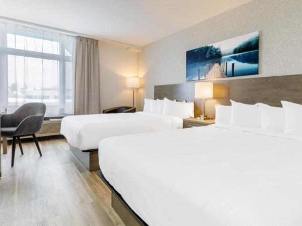 Repotel Henri IV Québec : photo 2 de la chambre chambre deluxe avec 2 lits queen-size