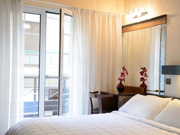 Victory Inn : photo 1 de la chambre chambre double avec petit balcon