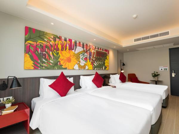 Maitria Hotel Rama 9 Bangkok - A Chatrium Collection : photo 2 de la chambre hébergement triple premier - vue sur jardin
