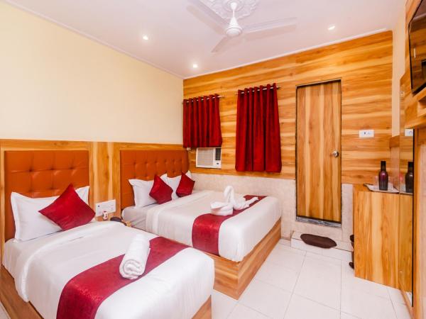 Aman Hotel near CST : photo 1 de la chambre triple bed ac