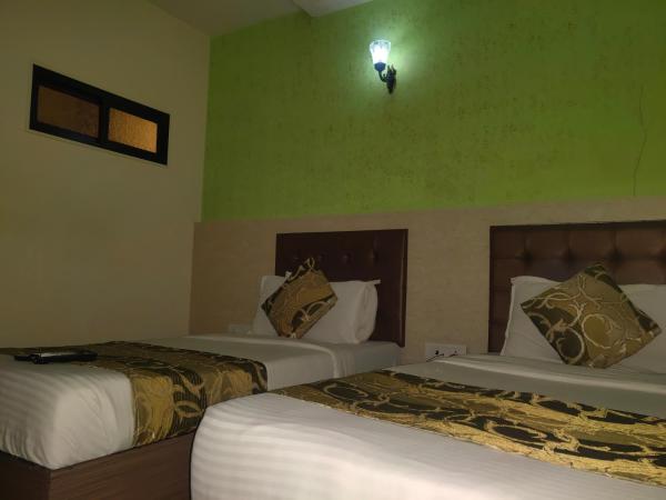 Hotel Golden Nest Popular Residency : photo 1 de la chambre chambre lits jumeaux deluxe