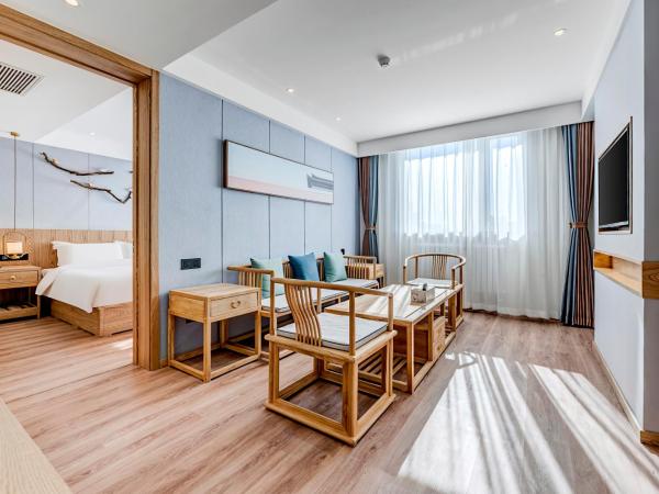 Happy Dragon Universal Vacation Hotel - close to Universal Studio and Wanda Plaza,free pick up to the studio,Free Coffee,Laundry : photo 1 de la chambre suite exécutive