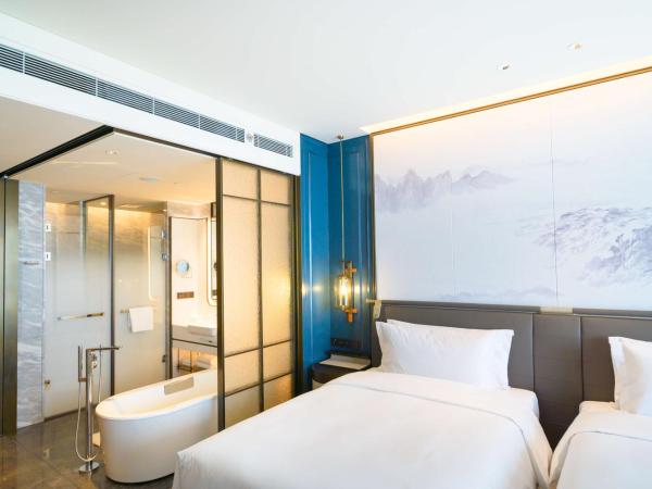 青岛海天大酒店 : photo 1 de la chambre chambre lits jumeaux - vue sur mer