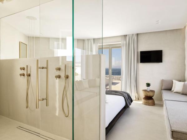 Mykonos Earth Suites : photo 1 de la chambre chambre deluxe avec bain à remous chauffé - vue sur mer