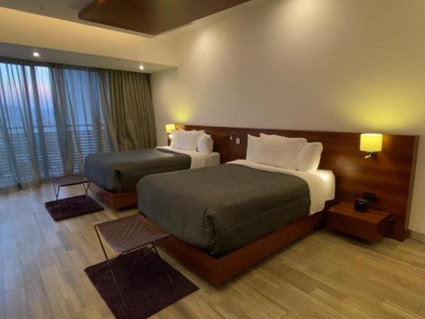 Sonata Hotel Puebla Angelópolis Distrito Sonata : photo 1 de la chambre chambre deluxe avec 2 lits queen-size