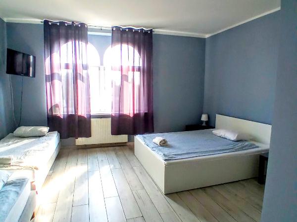 Central Sopot : photo 2 de la chambre chambre familiale avec salle de bains privative