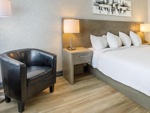 Repotel Aéroport Québec : photo 2 de la chambre chambre lit king-size supérieure