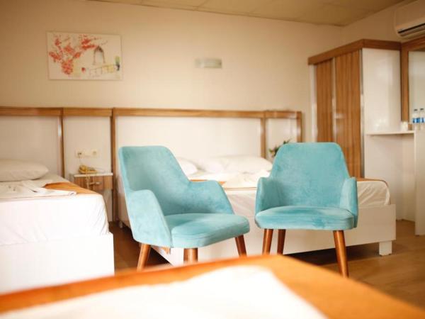 Özhan Hotel : photo 1 de la chambre chambre quadruple avec balcon