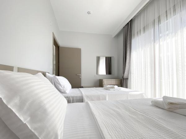 Azize Palas Apart Otel : photo 1 de la chambre chambre quadruple - vue sur mer